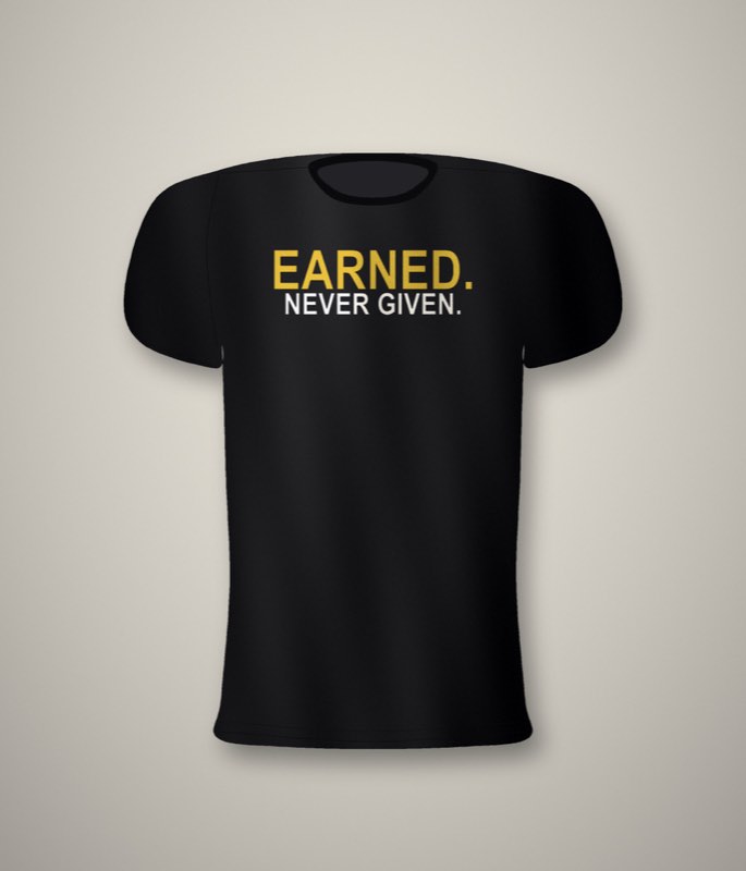 Black unisex tee with a large two-line back print reading Earned. Never given.